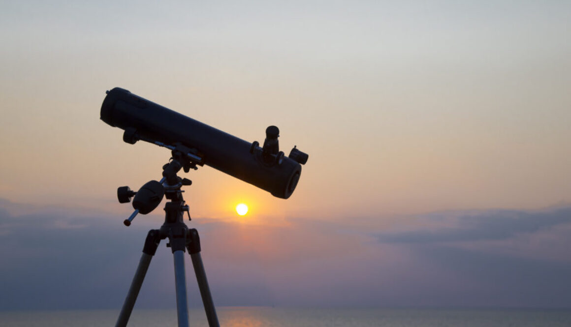 the telescope silhouette at orange sunset