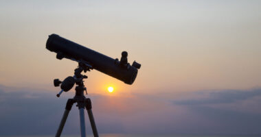the telescope silhouette at orange sunset